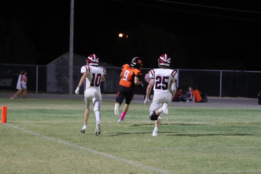 Brandon Day leaves Waurika player behind and scores a touchdown. 

